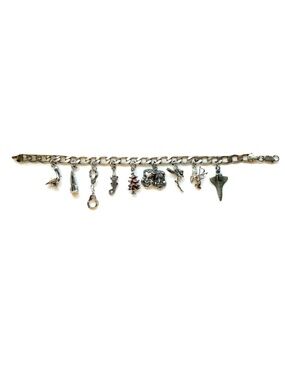 Sterling silver whimsical charm bracelet with 9 charms